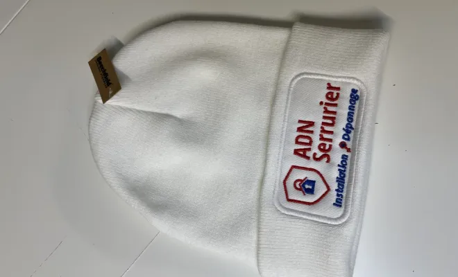 Doudoune brodée pour ADN Serrurier à Vienne réalisée par Print France, près de Bourg-en-Bresse, Print France